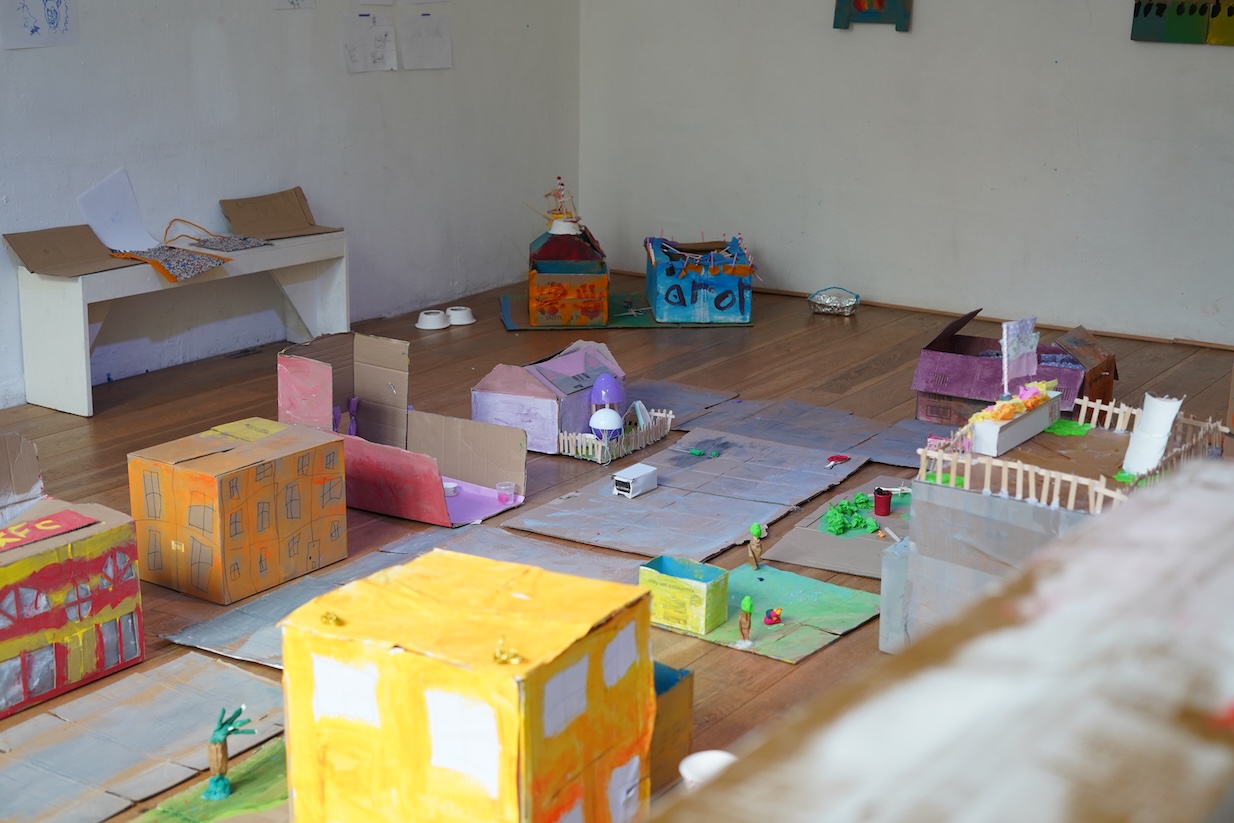 painted cardboard with clay and tissue paper
